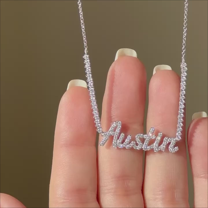 Luxe Diamond Script Name Necklace in 14k white gold with initials AUSTIN held in hand and put on neck of model with no audio