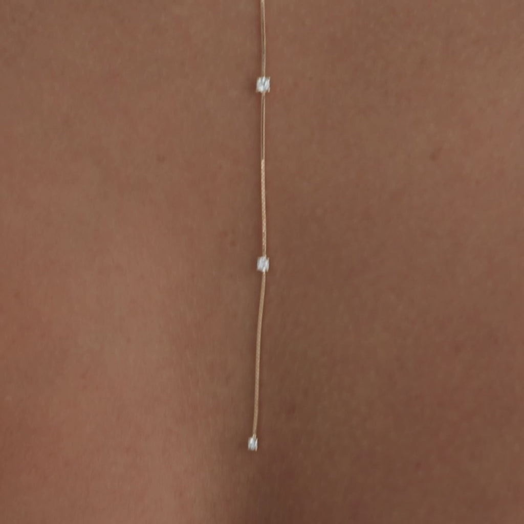 7 Prong Set Diamond Necklace in 14k yellow gold styled on model with diamond necklaces with no audio