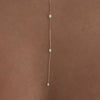 7 Prong Set Diamond Necklace in 14k yellow gold styled on model with diamond necklaces with no audio