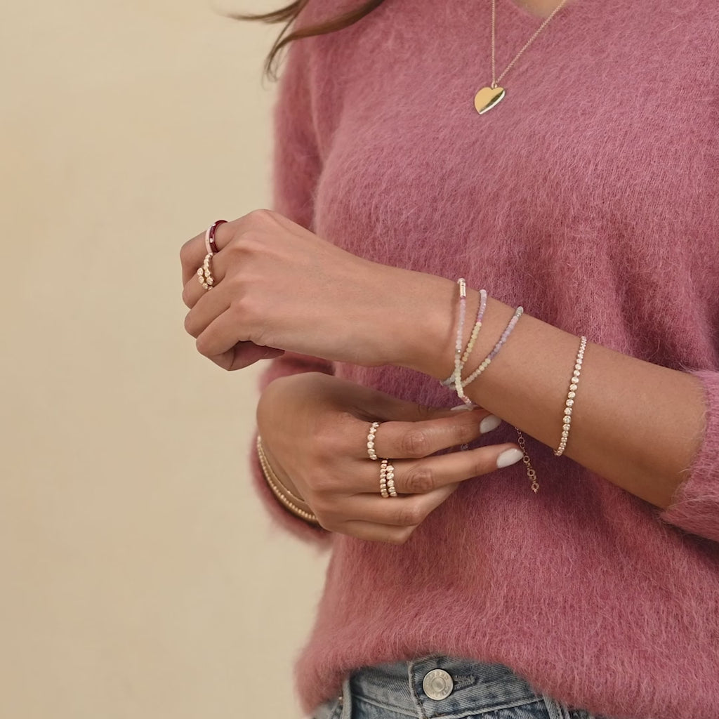 Ombré Sapphire Birthstone Bead Necklace & Triple Wrap Bracelet in 14k yellow gold styled on wrist of model then on neck of model with no audio