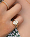 Diamond Hummingbird Signet Ring in 14k yellow gold styled on pinky ring of model
