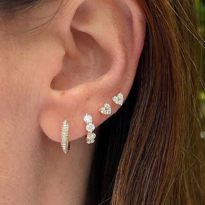 Full Cut Diamond Mini Heart Stud Earring in 14k yellow gold styled on ear of model