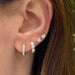 Full Cut Diamond Mini Heart Stud Earring in 14k yellow gold styled on ear of model