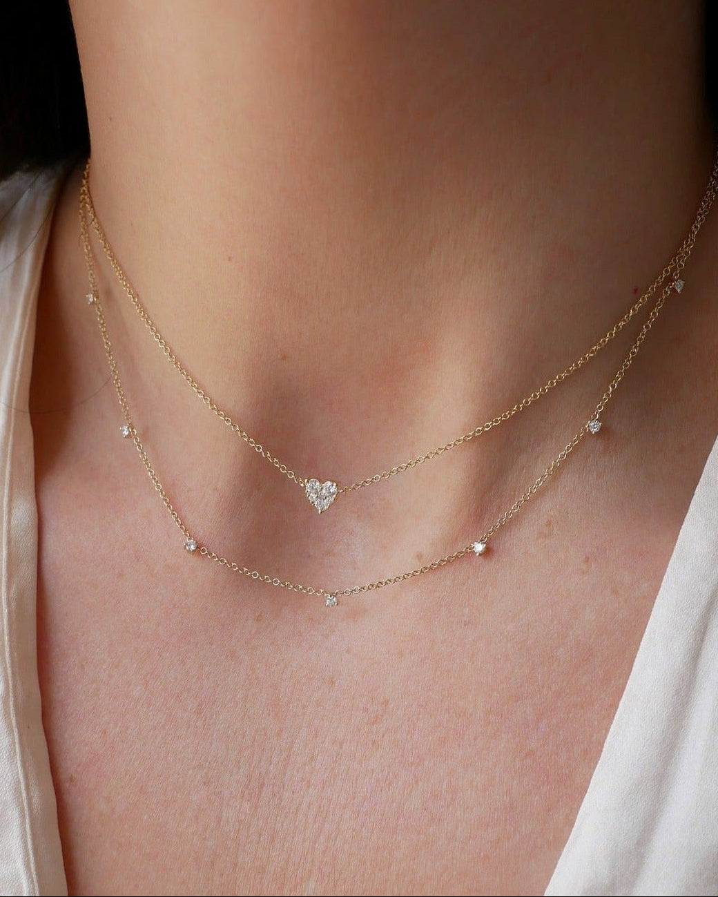 7 Prong Set Diamond Necklace in 14k yellow gold styled on neck of model