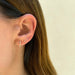 Baby Marquise Diamond Stud Earring styled on the ear in yellow gold
