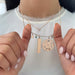 Gold Star Necklace Charm styled on the neck in rose gold