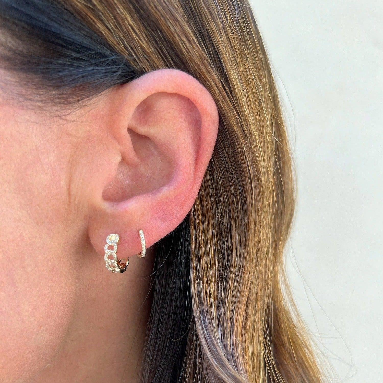 14k Yellow Gold Diamond Curb Chain Huggie Earring on ear