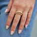 Gold Jumbo Ball Stack Ring in 14k yellow gold styled on middle finger of model stacked on top of Jumbo Gold Ball Stack Ring