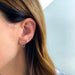 Diamond Baguette Bar Chain Stud Earring in 14k yellow gold styled on ear of model