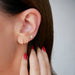 Diamond Trio Stud Earring in 14k yellow gold styled on ear of model