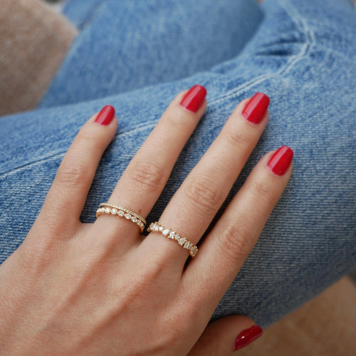 Half Diamond Multi Faceted Ring styled on the hand in yellow gold 