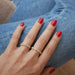 Half Diamond Multi Faceted Ring styled on the hand in yellow gold 