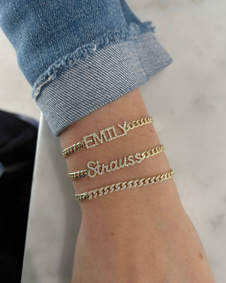 Diamond Block Name Curb Chain Bracelet styled on the wrist in yellow gold