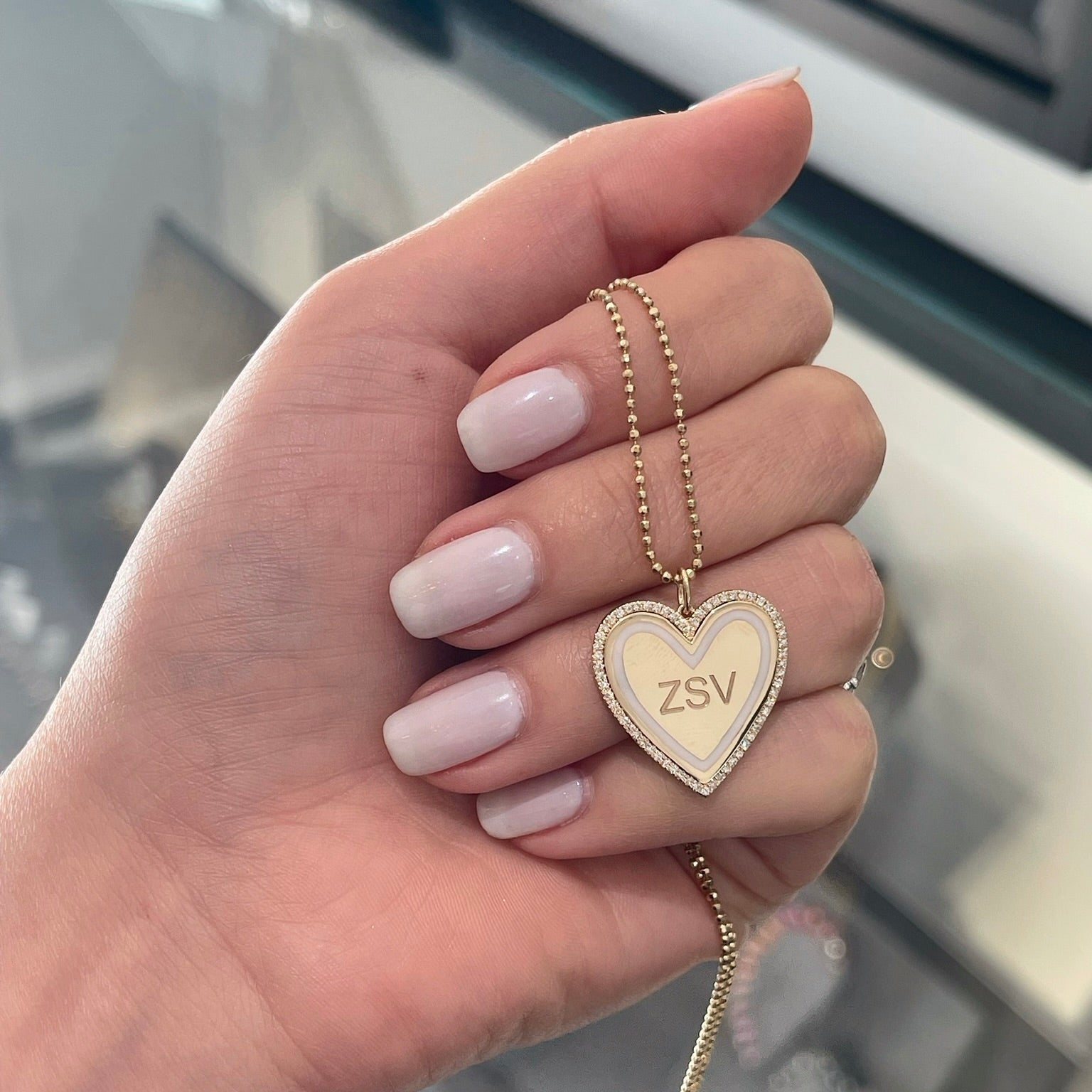 Diamond & White Enamel Heart Charm shown with engraving