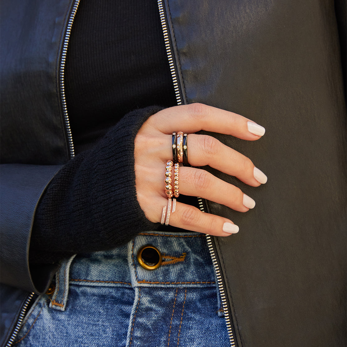 Black cashmere wrist warmer styled on the hand 