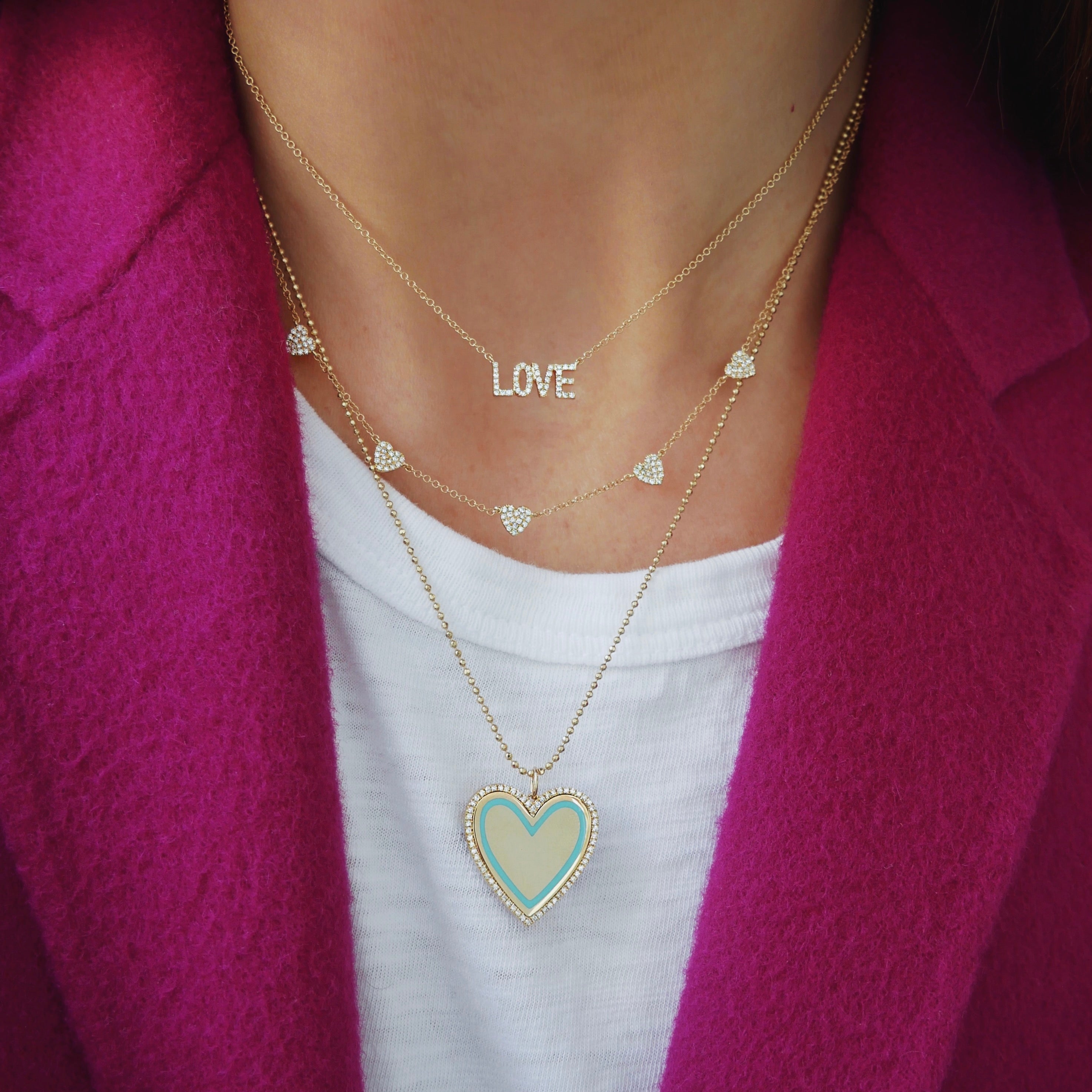 Diamond & Turquoise Enamel Heart Necklace styled on the neck in yellow gold