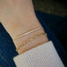 The Arm Candy Gift Set in 14k Yellow Gold Styled on Wrist of Model