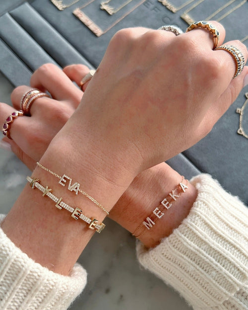 Diamond Custom Name Bracelet styled on the wrist in yellow gold
