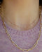 Diamond Multi Initial Necklace in 14k yellow gold styled on neck of model in initials LOTTIE model wearing gold chain and pink sweater