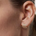 14k Yellow Gold Diamond Multi Huggie Earring Styled on Ear