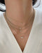 Diamond Butterfly Necklace on the neck in yellow gold