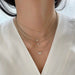 Diamond Butterfly Necklace on the neck in yellow gold