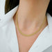 Gold Mesh Necklace in 14k yellow gold styled on neck of model wearing white blouse