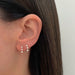 Triple Prong Set Diamond Stud Earring in 14k yellow gold styled on ear lobe of model