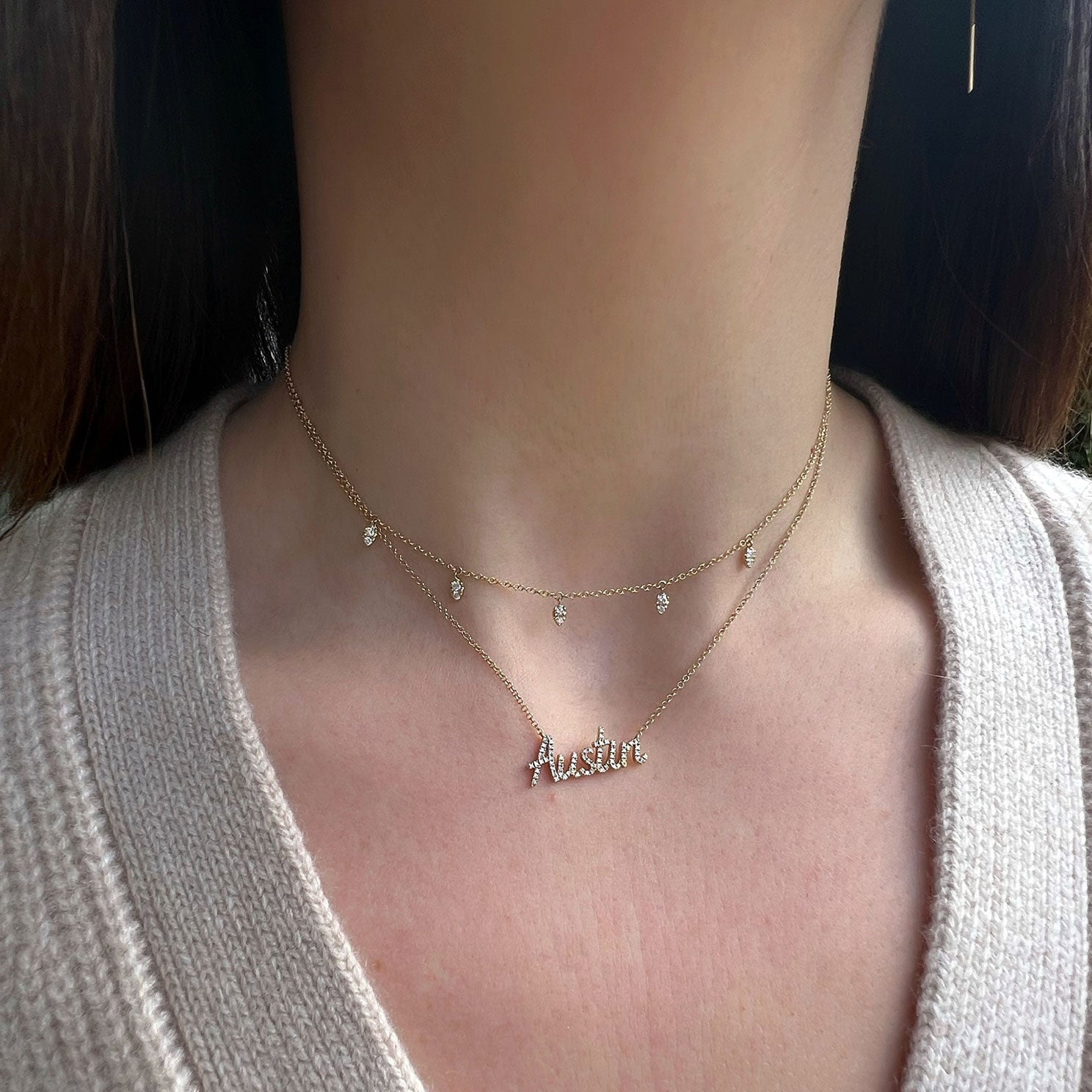 Diamond 5 Teardrop Choker Necklace in 14k yellow gold styled on neck of model with diamond script necklace with initials AUSTIN