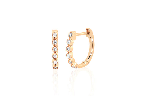 Diamond Bezel Huggie Earring in 14k yellow gold