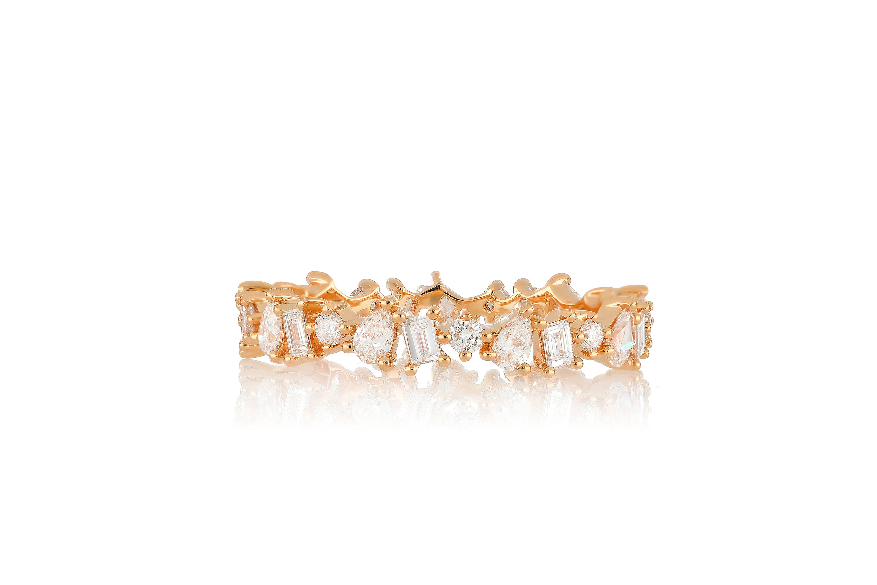 14k rose gold multi faceted diamond ring with baguette diamonds, pear shaped diamonds, and round diamonds all around.