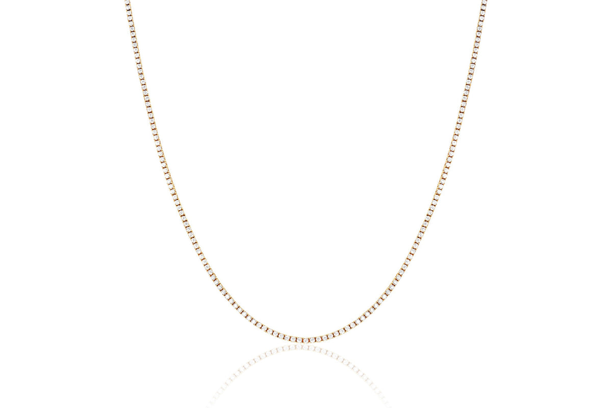 Half view Diamond Grace Necklace with one single row of diamonds almost all the way up the chain in 14k yellow gold.