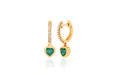 14k (karat) yellow gold diamond encrusted huggie earrings with 5mm heart-shaped drop pendant with emerald green jewel in the center.