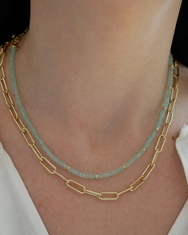 Birthstone Bead Necklace In Chalcedony styled on neck of model with gold lola chain necklace