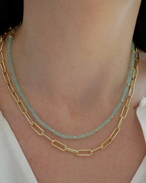 Birthstone Bead Necklace In Chalcedony styled on neck of model with gold lola chain necklace