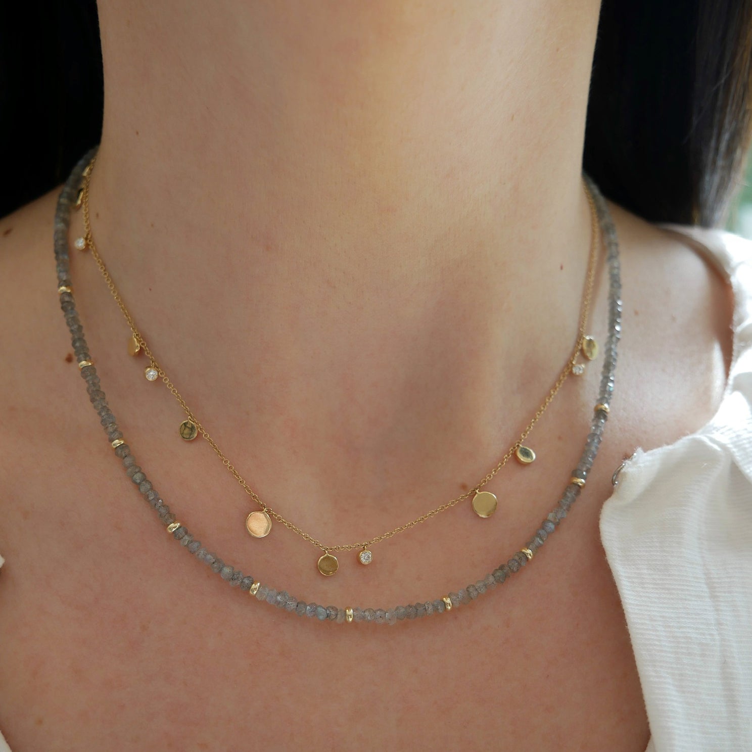 Birthstone Bead Necklace In Labradorite styled on neck with gold confetti necklace