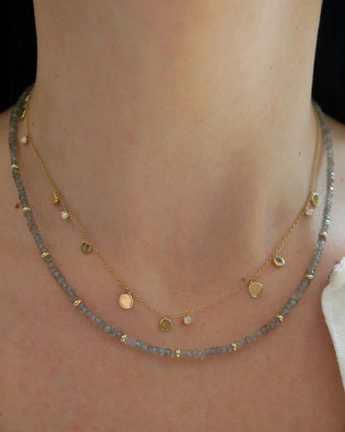 Birthstone Bead Necklace In Labradorite styled on neck with gold confetti necklace