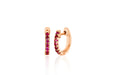 14k (karat) rose gold huggie earrings measuring 10 mm in height with precious ruby stones measuring 1.5 mm in width set in the front.