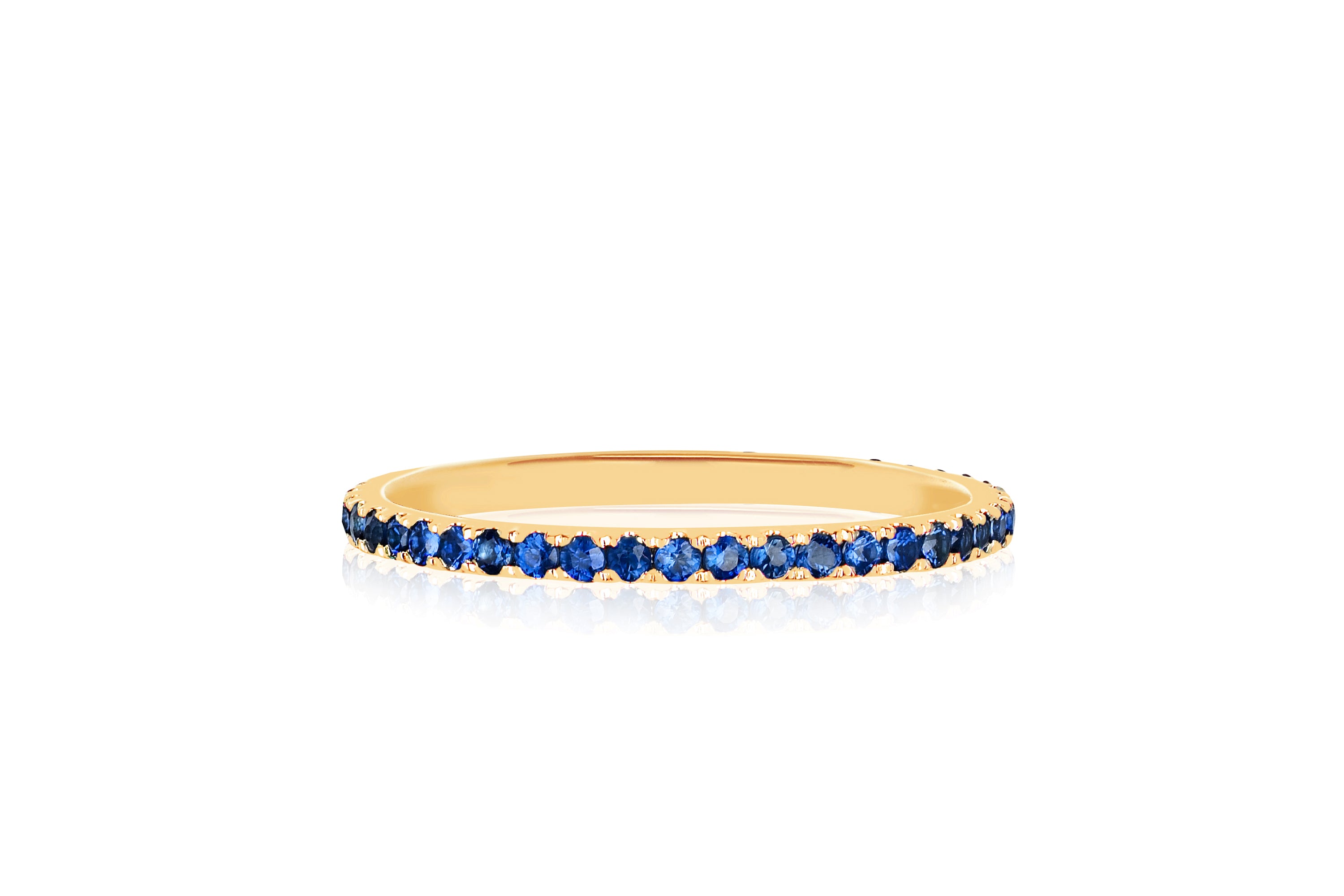 14k (karat) yellow gold ring with blue sapphire gemstones encircling.