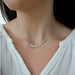 Luxe Diamond Script Name Necklace in 14k white gold with initials AUSTIN styled on neck of model