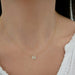 Diamond Flutter Necklace in 14k yellow gold styled on neck of model