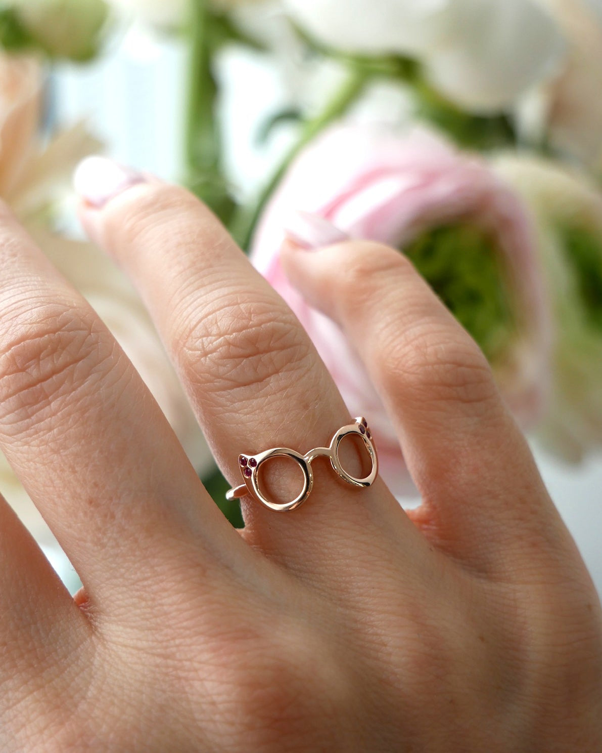 Evan's Sunnies Ring with Rubies in 14k yellow gold styled on ring finger of model
