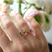 Evan's Sunnies Ring with Rubies in 14k yellow gold styled on ring finger of model