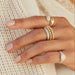Gold and Diamond Jumbo Double Dome Ring in 14k yellow gold styled on index finger of model next to stacked diamond and gold ball rings
