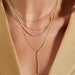 Pave Diamond Marquise Necklace styled on the neck in yellow gold