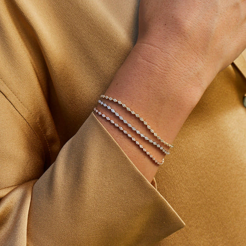 Pave Diamond Marquise Eternity Bracelet in yellow gold, rose gold, and white gold styled on wrist