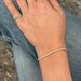 Yellow gold Grace Bracelet styled on wrist