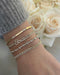Diamond Script Name Curb Chain Bracelet on the wrist in yellow gold