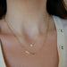 Mini Link Necklace on the neck in yellow gold