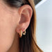 14k Yellow Gold Diamond Bezel Shimmy Huggie Earrings Styled on Ear